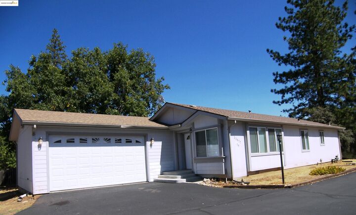 Property Photo: 22877 E Parkwood Dr. CA 95321