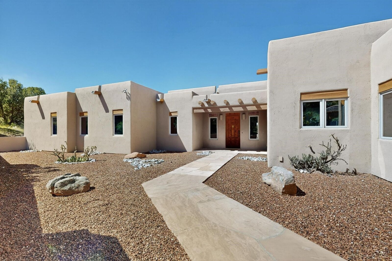 Property Photo:  8 Calle Margosa  NM 87508 