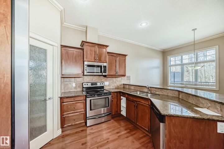 Property Photo: 12610 15 Avenue SW 13 AB T6W 1X1