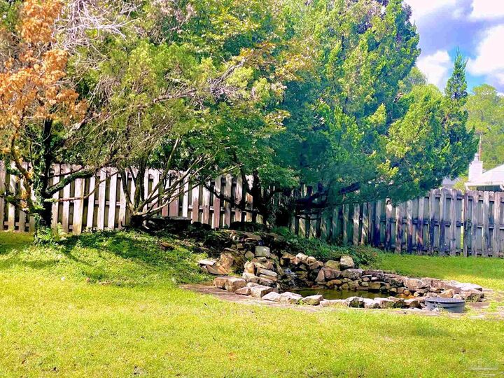 Property Photo:  5615 Whispering Woods Dr  FL 32571