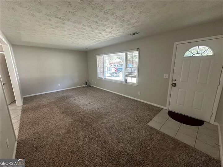 Property Photo:  727 S Carter Drive  GA 30236 