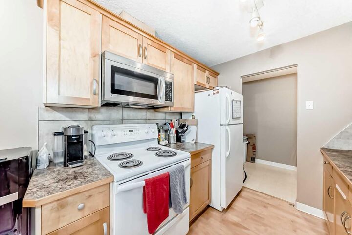 Property Photo:  13045 6 Street SW 3207  AB T2W 5H1