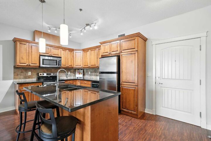 Property Photo:  4707 50 Street 203  AB T4S 0G7 