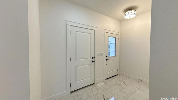 Property Photo: 147 Woolf Bend SK S7W 0L6