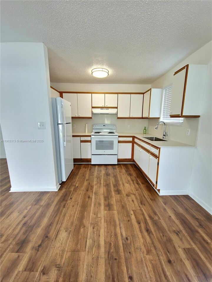 Property Photo:  20203 SW 122nd Ct  FL 33177 