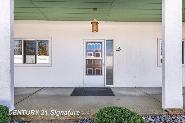 Property Photo:  9135 Greenway Boulevard K-164  MI 48609