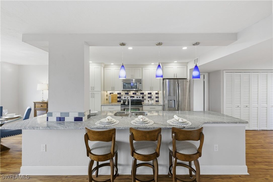 Property Photo:  11 Bluebill Avenue 201  FL 34108 