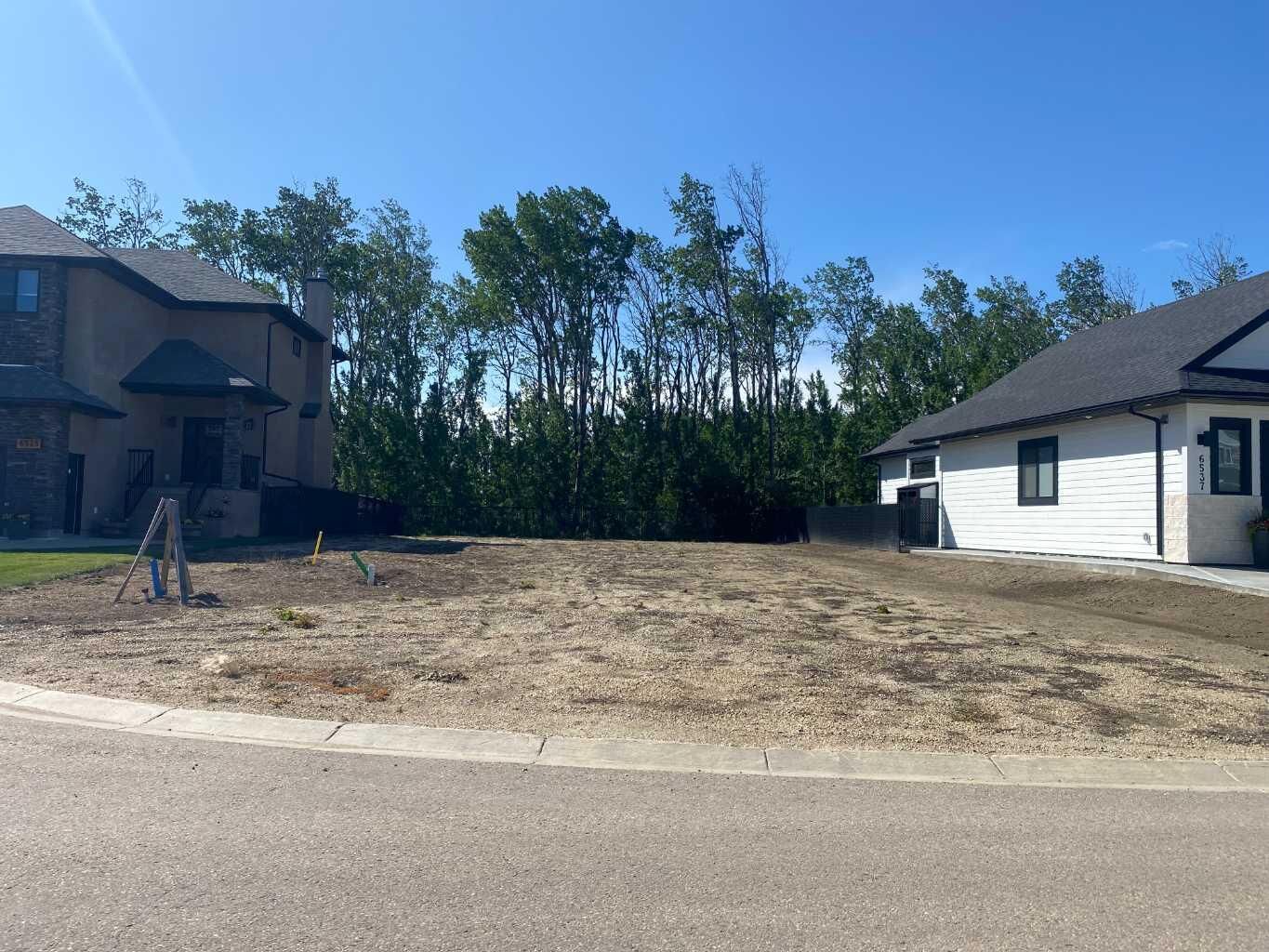 Property Photo: 6541 Grande Banks Drive AB T8W 0K7