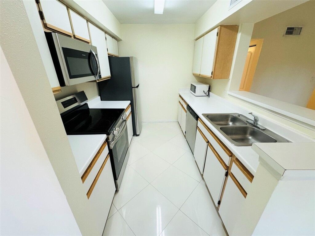 Property Photo:  2405 NW 33rd Street 1216  FL 33309 