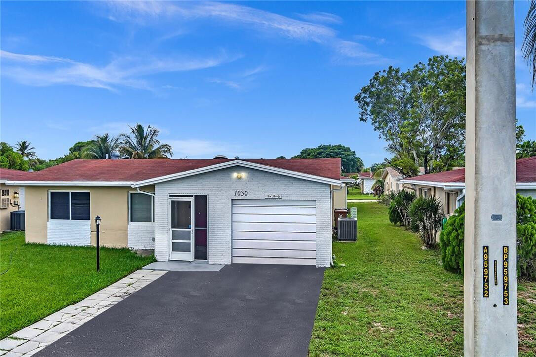Property Photo: 1030 NW 49th Court FL 33064