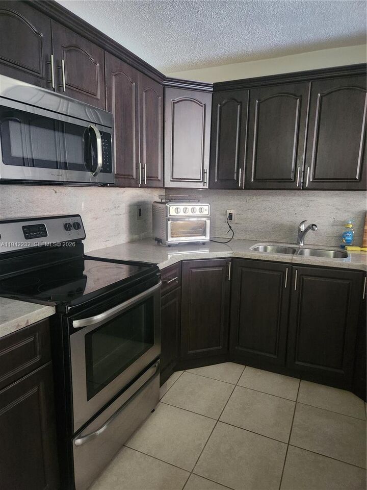 Property Photo:  7000 NW 186th St 4-314  FL 33015 
