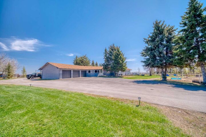 Property Photo:  354142 48 Street E  AB T1S 0R3 