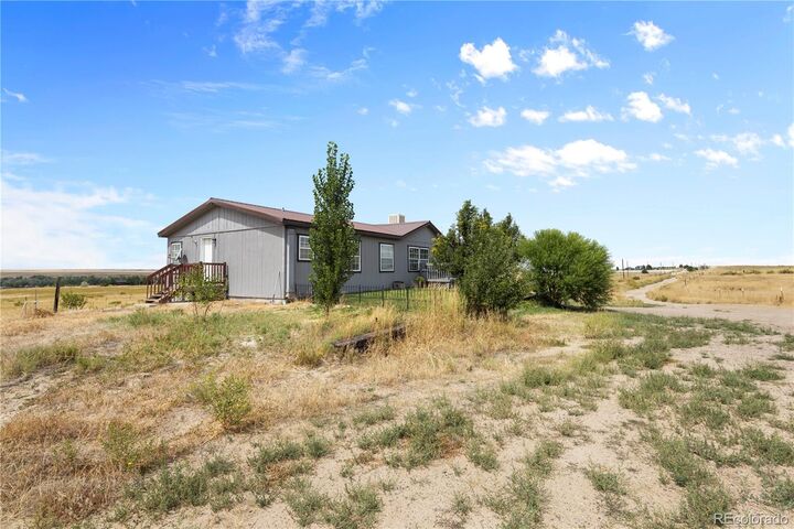 Property Photo:  47904 Dartmouth Avenue  CO 80102 