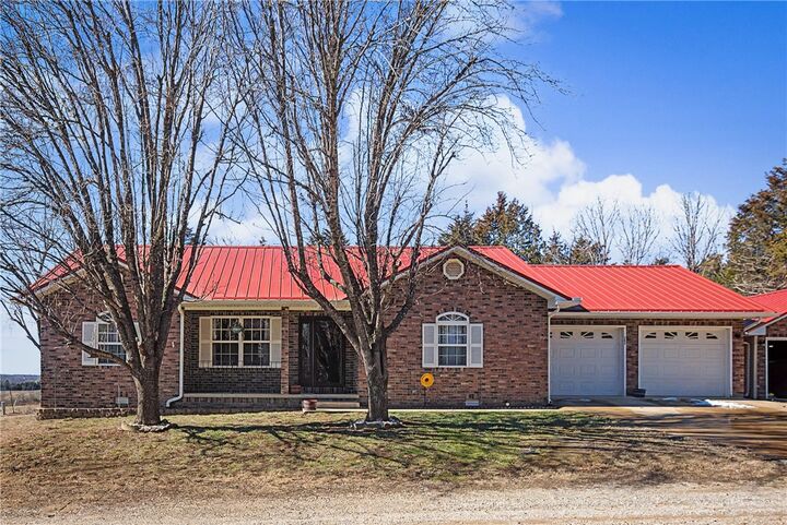 Property Photo:  303 W Robin Trail  AR 72644 