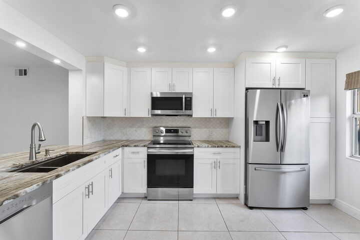 Property Photo:  1037 Guildford C  FL 33434 