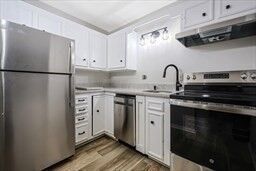 Property Photo:  30 High St ( Cass St Entrance) 209  MA 02026 