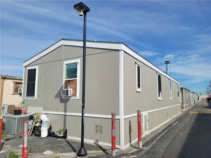 Property Photo:  12265 Woodruff Avenue 64  CA 90241 