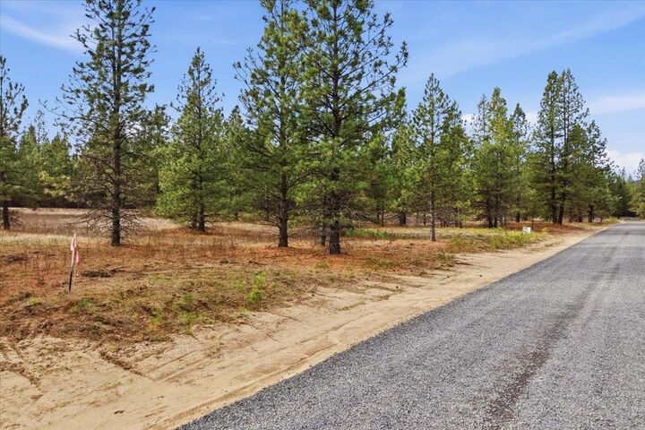 Property Photo:  65xx Whispering Pines Way Lot #1  WA 99026 