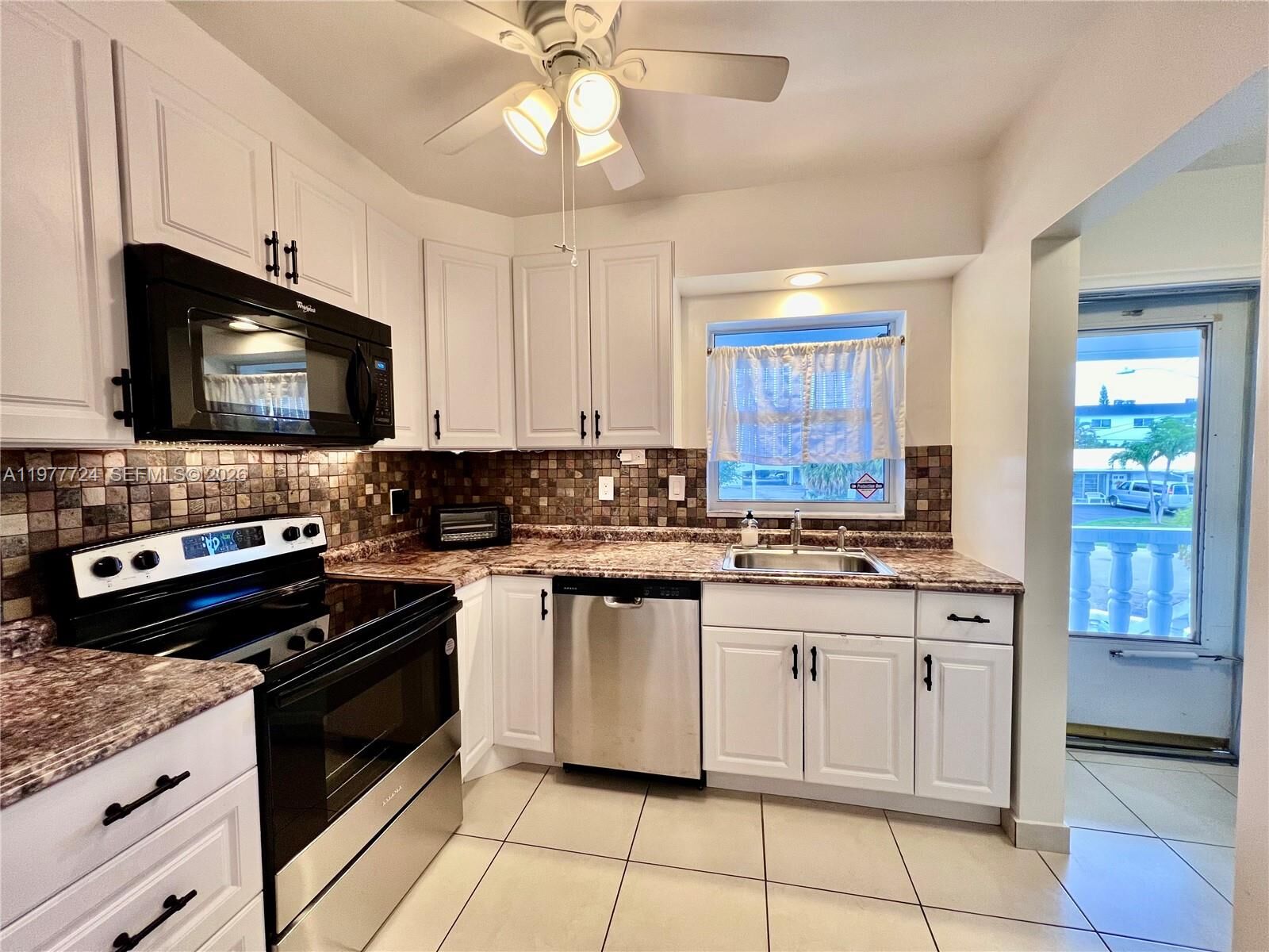 Property Photo:  1400 NE 55th St 201  FL 33334 