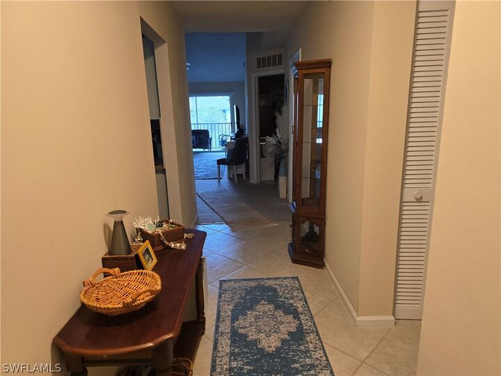 Property Photo:  5741 Whitaker Road D-203  FL 34112 