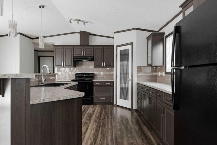 Property Photo:  309 McKinlay Crescent  AB T9K 2M9 