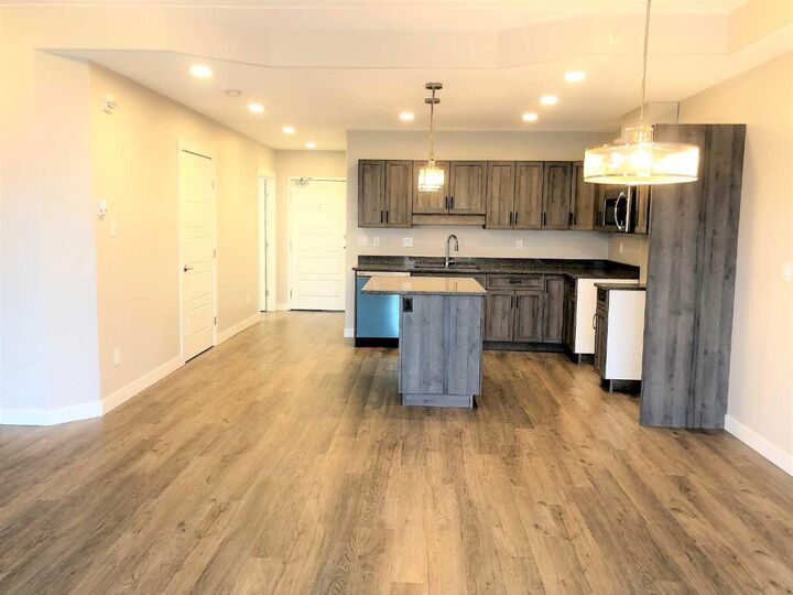 Property Photo: 499B Meadow Lake Court E 205 AB T1R 0Y7