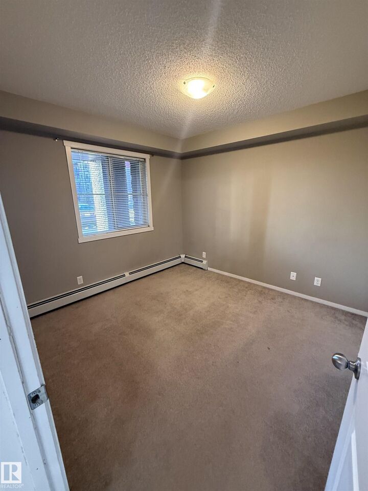 Property Photo: 3207 James Mowatt Trail SW 104 AB T6W 3L6