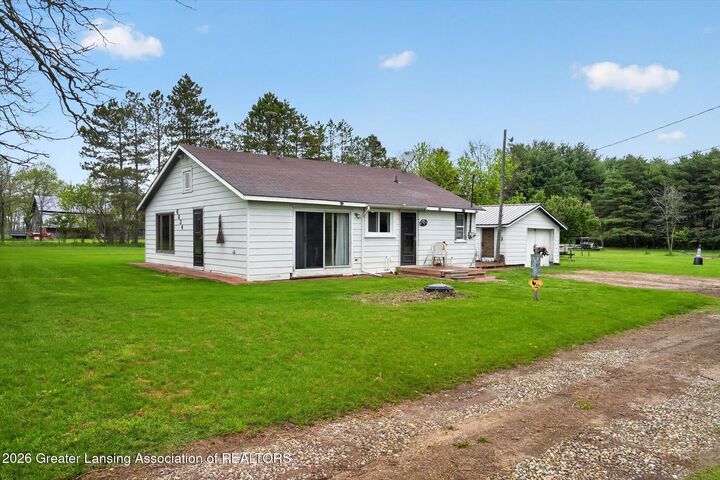 Property Photo:  6834 N Wacousta Road  MI 48835 