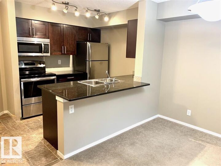 Property Photo: 3207 James Mowatt Trail SW 114 AB T6W 3L6