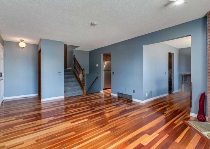 Property Photo:  223 Cedarwood Road SW  AB T2W 3G8 