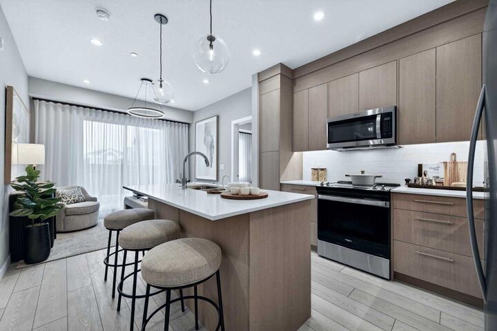 Property Photo:  265 Wolf Willow Boulevard SE 2304  AB T2X 6P9 