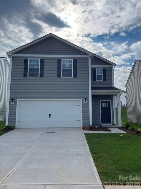Price-reduced 4-bedroom new home for sale at 12133 Barred Owl Court, Charlotte NC 28215 in Cardinal Creek