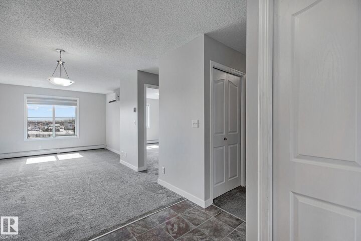 Property Photo:  12035 22 Avenue SW 306  AB T6W 2X9 