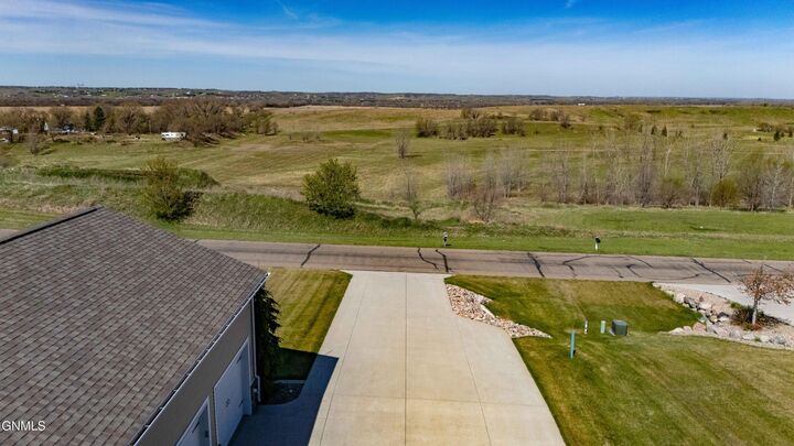 Property Photo:  7623 Hawktree Drive  ND 58503 