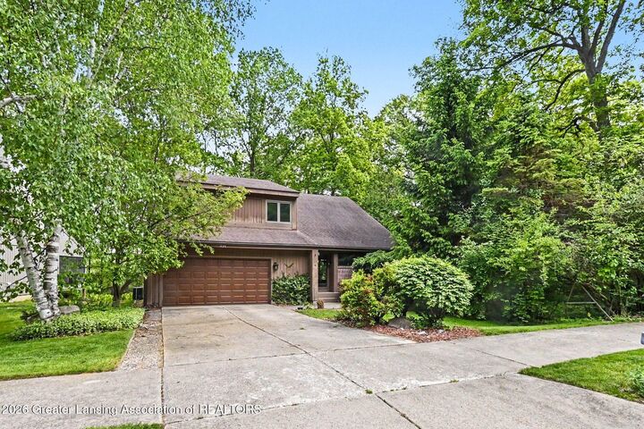 Property Photo:  1135 Woodwind Trail  MI 48840 