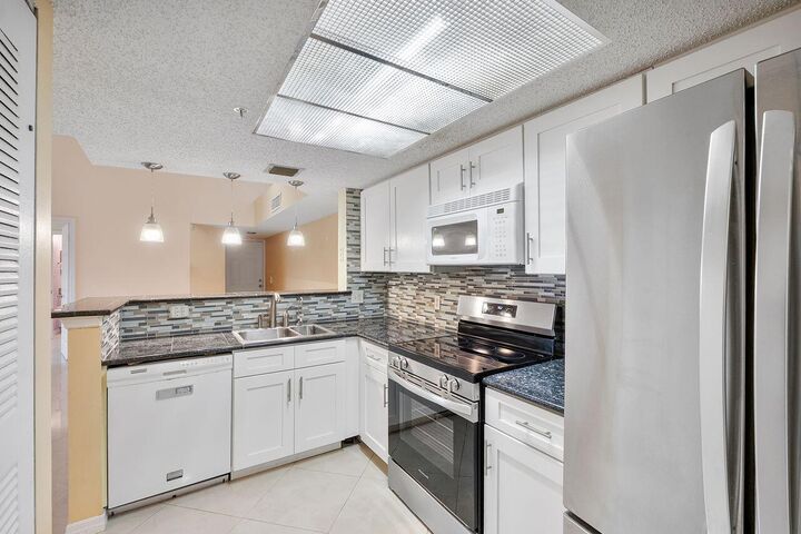 Property Photo:  5011 Wiles Road Unit 303  FL 33073 