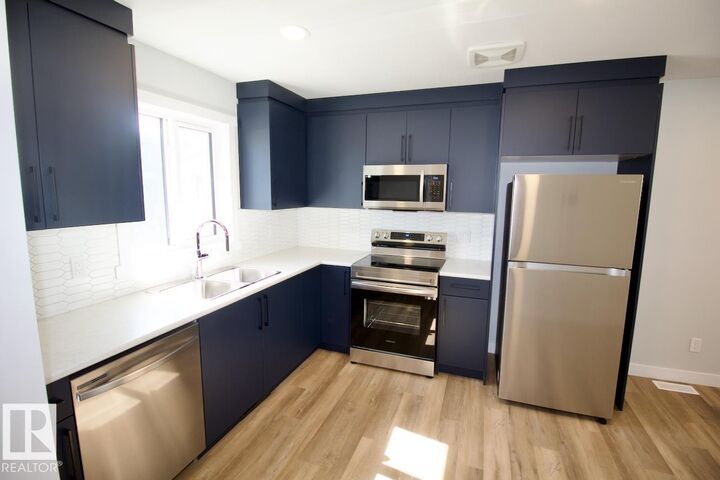 8043 Cedric Mah Road NW Garage — photo 1