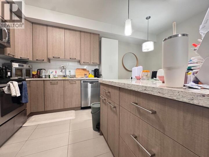 Property Photo:  7377 14th Avenue 305  BC V3N 1Z7 