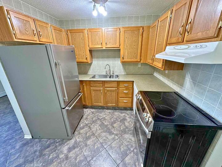 Property Photo: 7031 Gray Drive 102 AB T4P 2B1