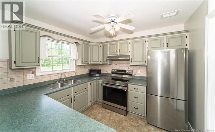 Property Photo:  519 Gardiner Street  NB E2V 1G5 