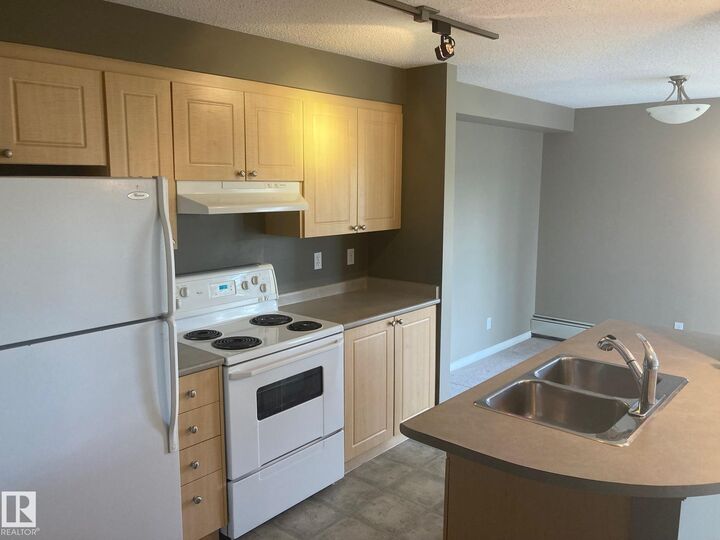 Property Photo: 616 McAllister Loop SW 206 AB T6W 3M5