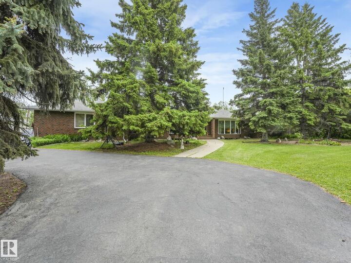 Property Photo: 11921 231 Street NW AB T5S 2C2