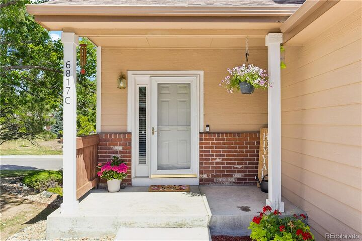 Property Photo:  6817 S Webster Street C  CO 80128 