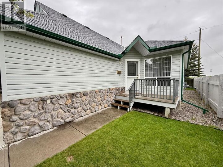 Property Photo: 211 Baker Creek Place Southwest AB T1V 1V6