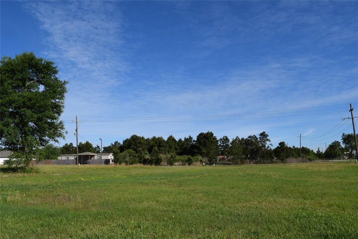 Property Photo: 1129 County Road 5100 TX 77327