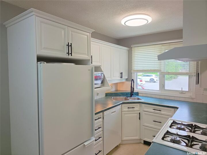 Property Photo:  1128 McKercher Drive 18  SK S7H 4Y7 