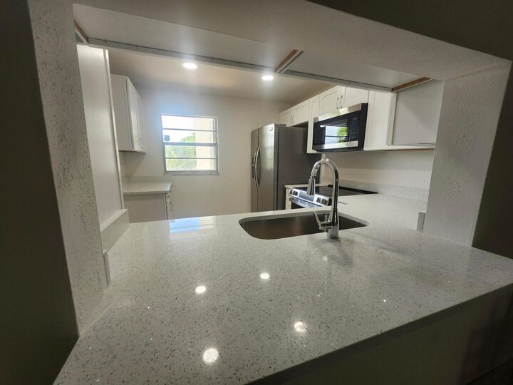 Property Photo:  330 NE 26th Avenue 202  FL 33435 