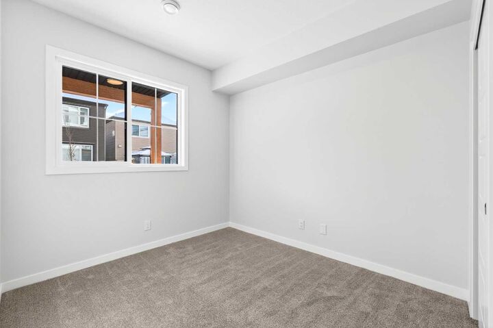 Property Photo: 28 Red Embers Plaza NE 105 AB T3N 2W1