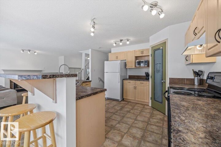 Property Photo:  8509 7 Avenue SW  AB T6X 1J2 