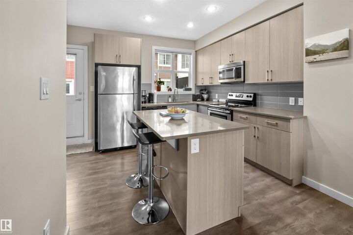 Property Photo:  2803 James Mowatt Trail SW 13  AB T6W 2P5 